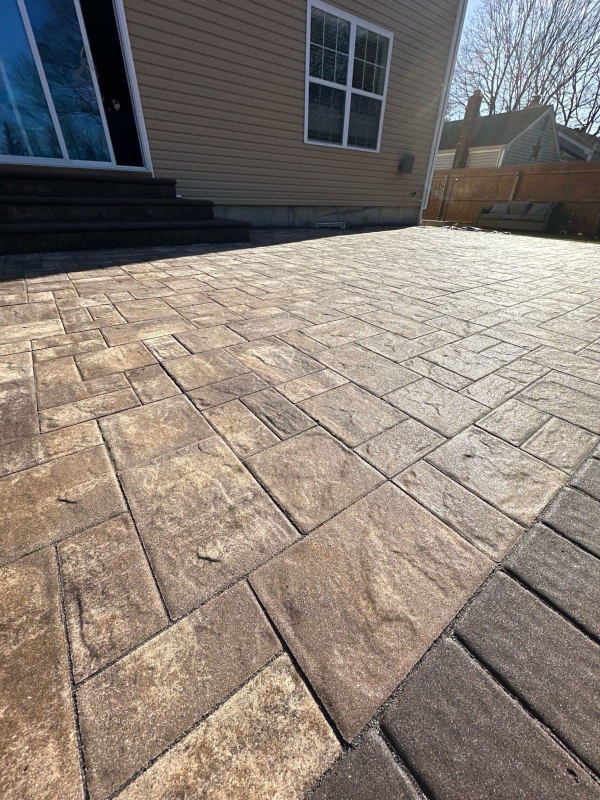 Freshly sealed paver patio in Huntington, NY
